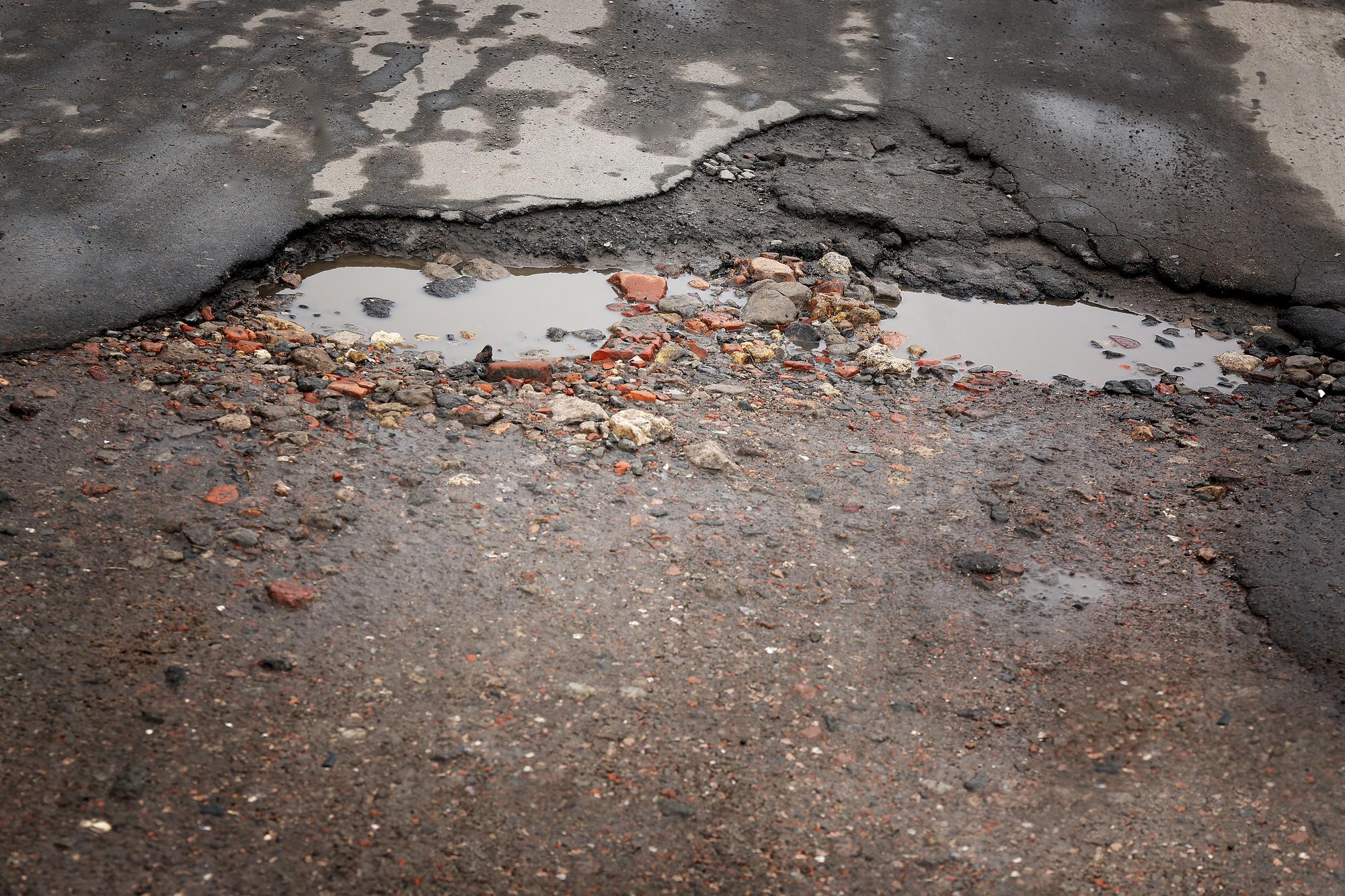 Pothole and roadway damage contributing to accidents in Roseville, California.