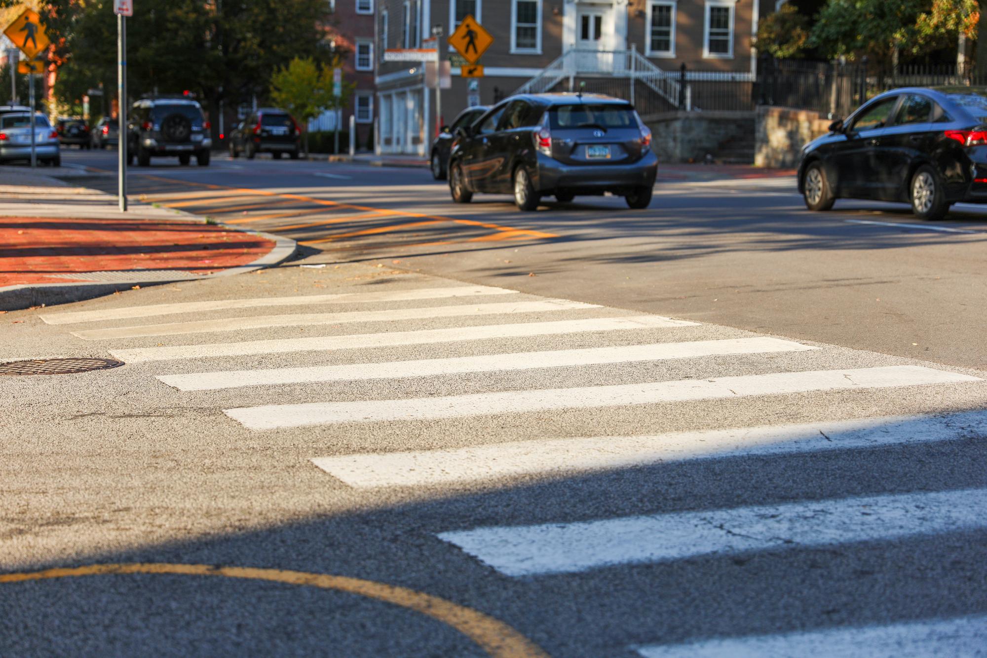 Pedestrian in a rainy crosswalk at night — Roseville pedestrian accident lawyers