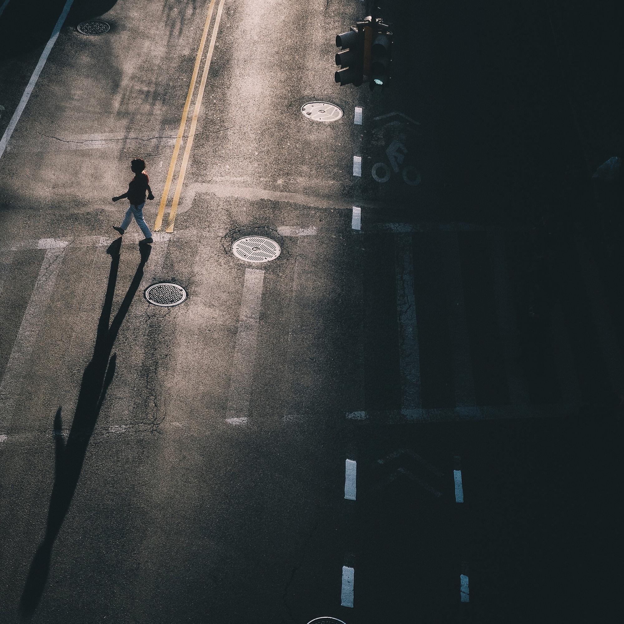 Pedestrian crossing a marked crosswalk on a Sacramento, California street