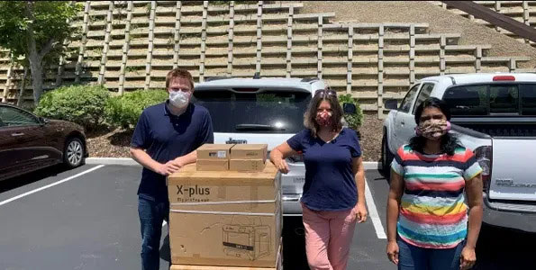 Completed batch of donated face shields ready for first responders